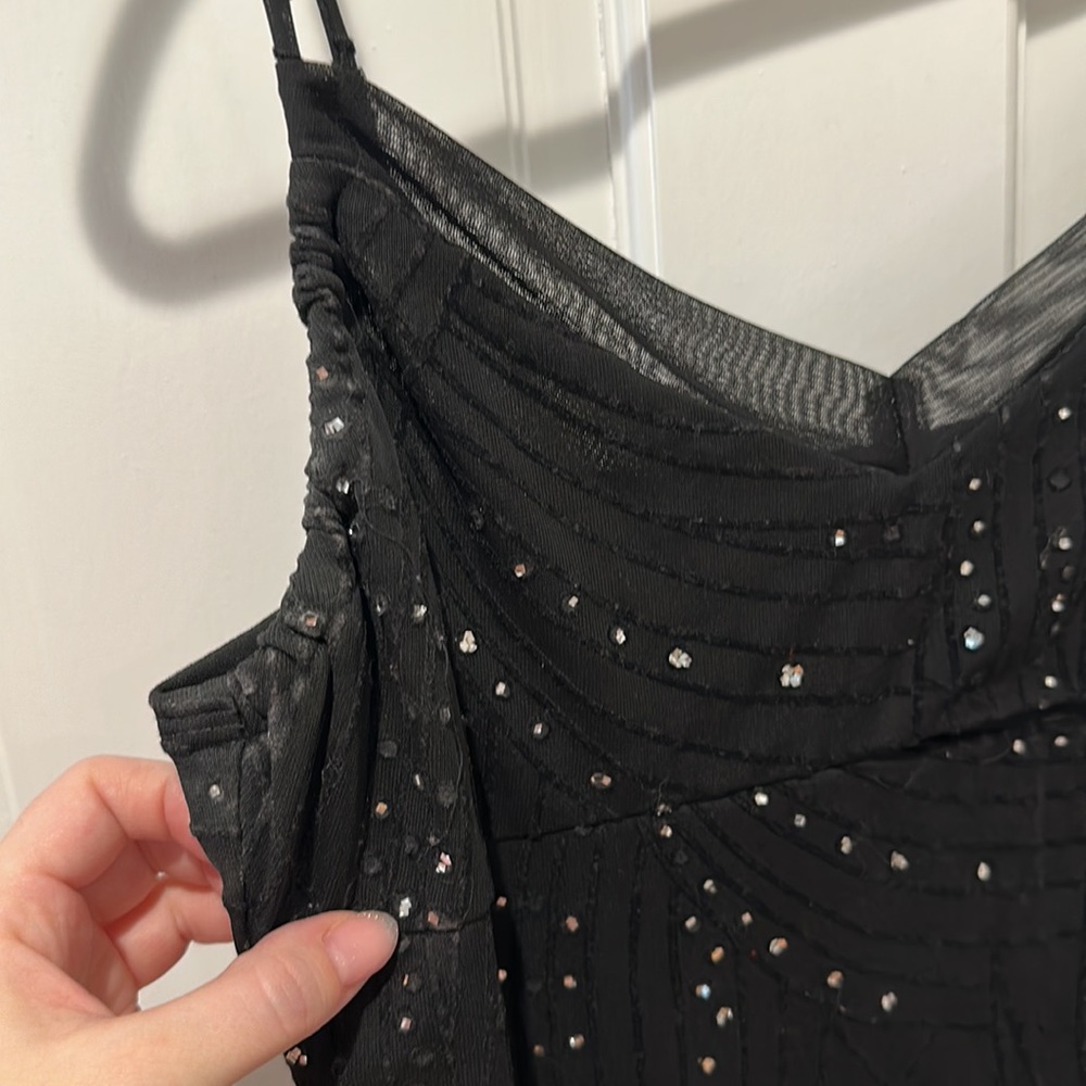 Black mesh overlay gown with shimmering details
